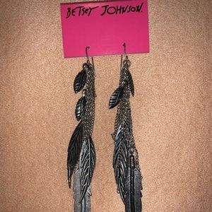 Betsey Johnson silver leaf earrings, Clair’s ear